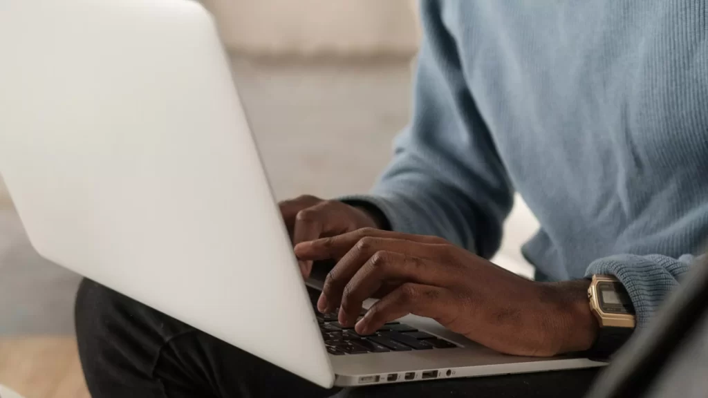 Man typing on laptop