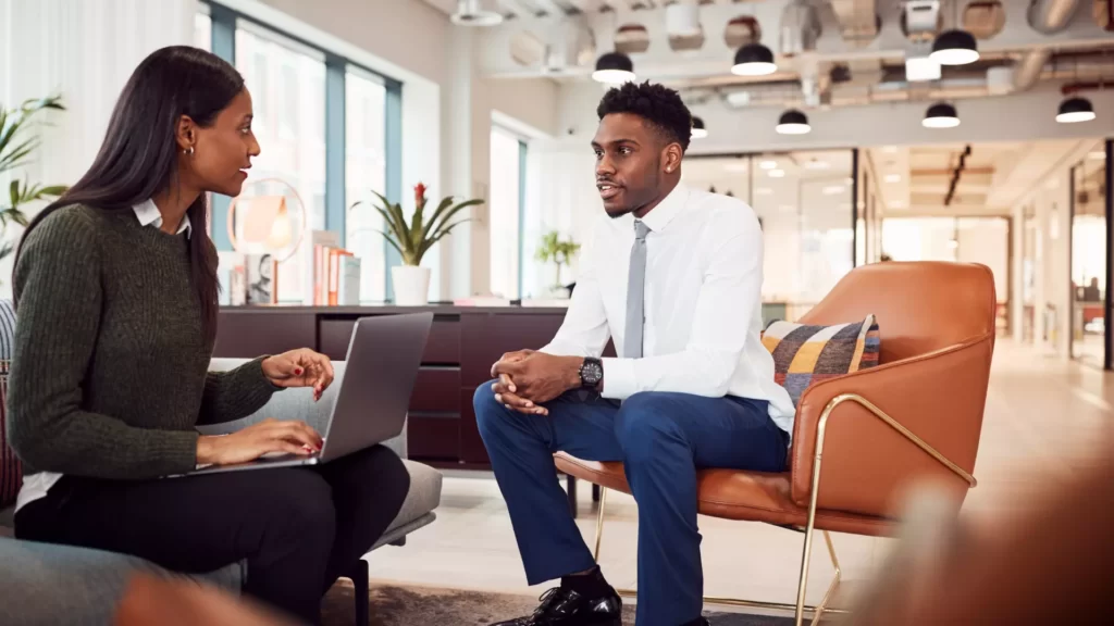 Career and leadership coaching in Canada with a man and women talking.